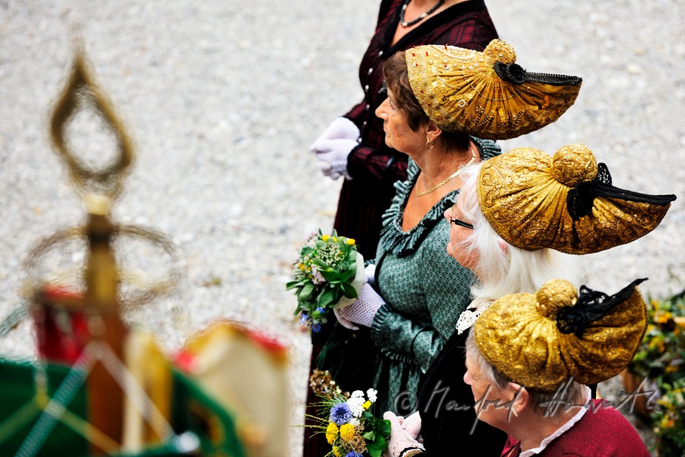 attendants of the open air mass in traditional clothes