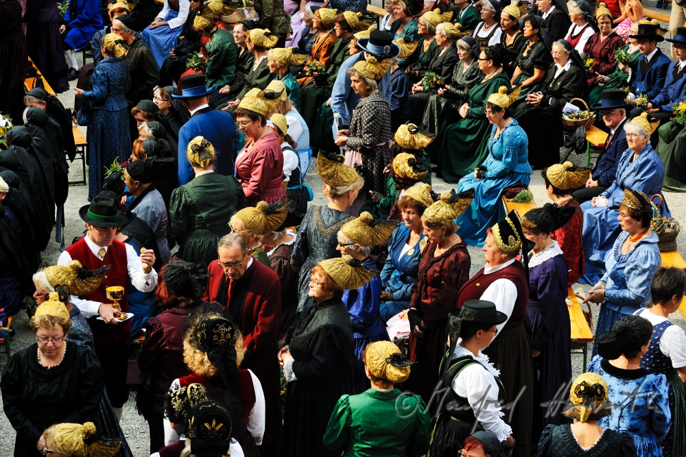 attendants of the open air mass in traditional clothes