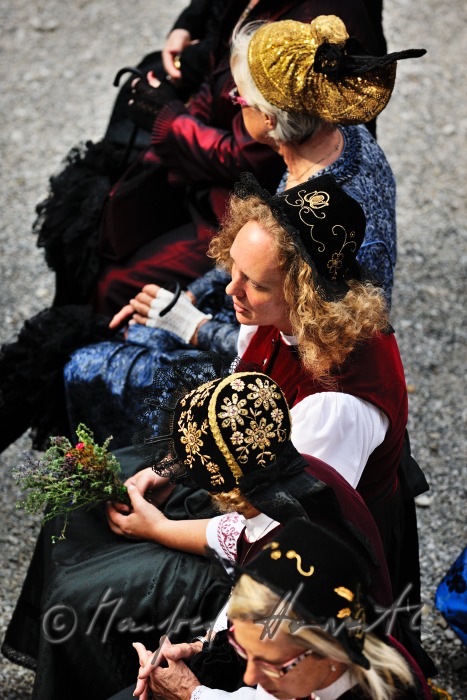 attendants of the open air mass in traditional clothes
