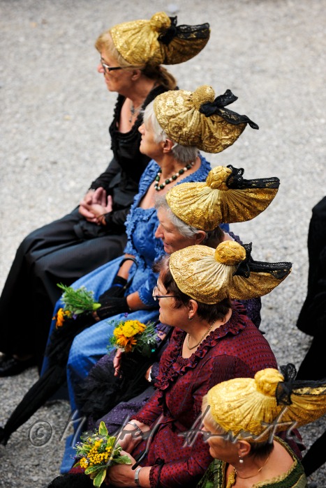 attendants of the open air mass in traditional clothes