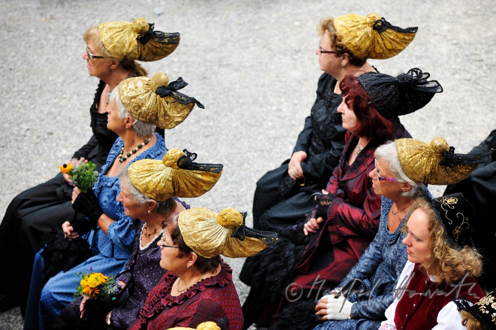 attendants of the open air mass in traditional clothes