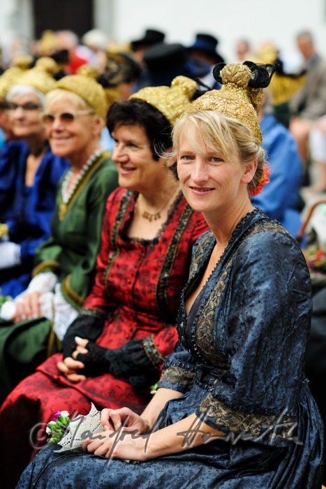 attendants of the open air mass in traditional clothes