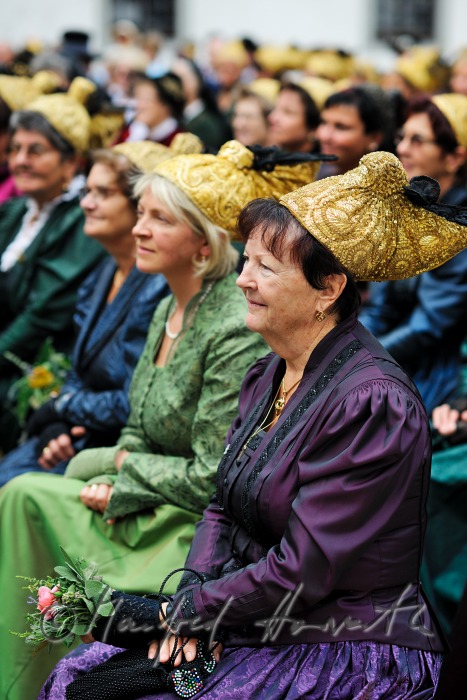 attendants of the open air mass in traditional clothes