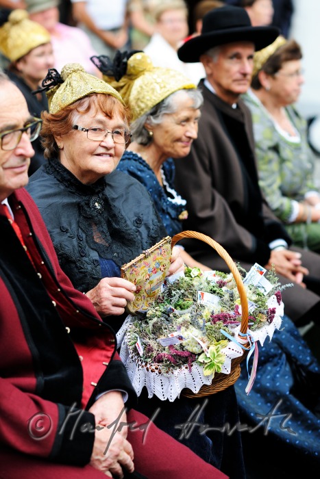 attendants of the open air mass in traditional clothes