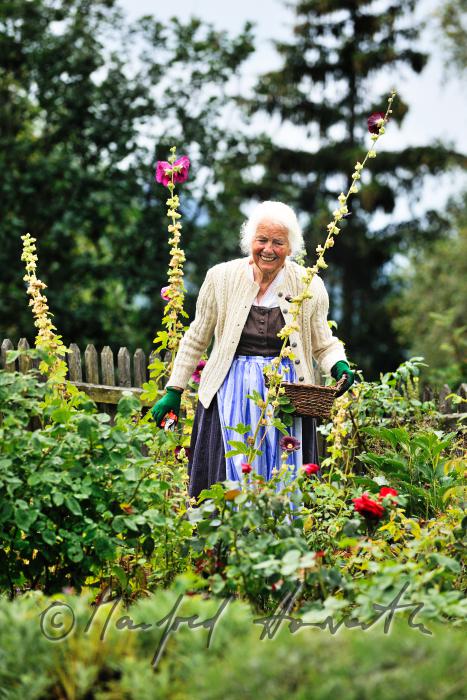 Mrs Ingolde Fuchs working in her garden