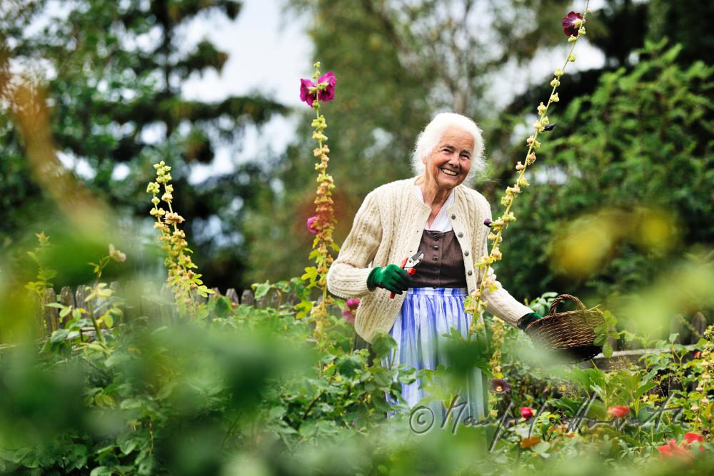 Mrs Ingolde Fuchs working in her garden