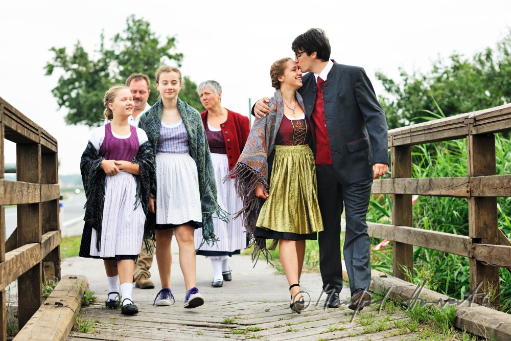 family going to church on Sunday in traditional dresses