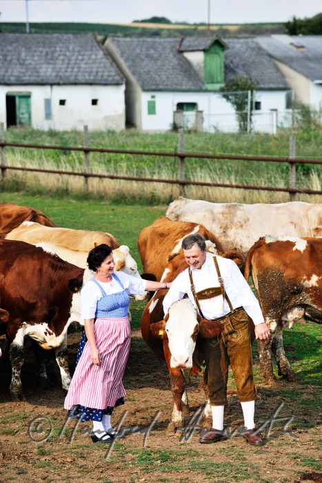 farmers in traditional clothes with live stock