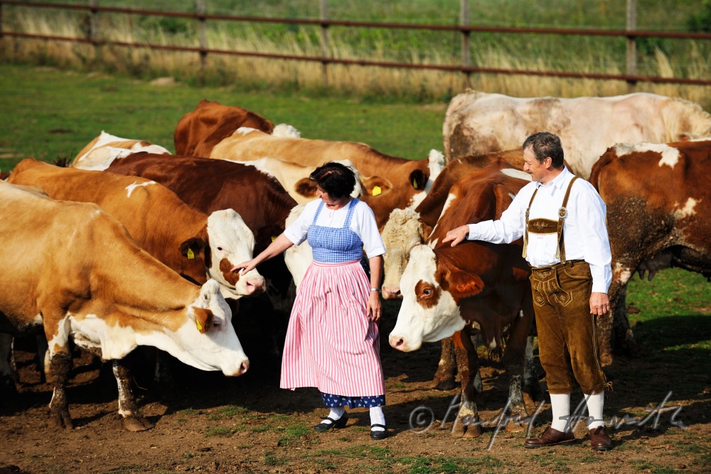 farmers in traditional clothes with live stock