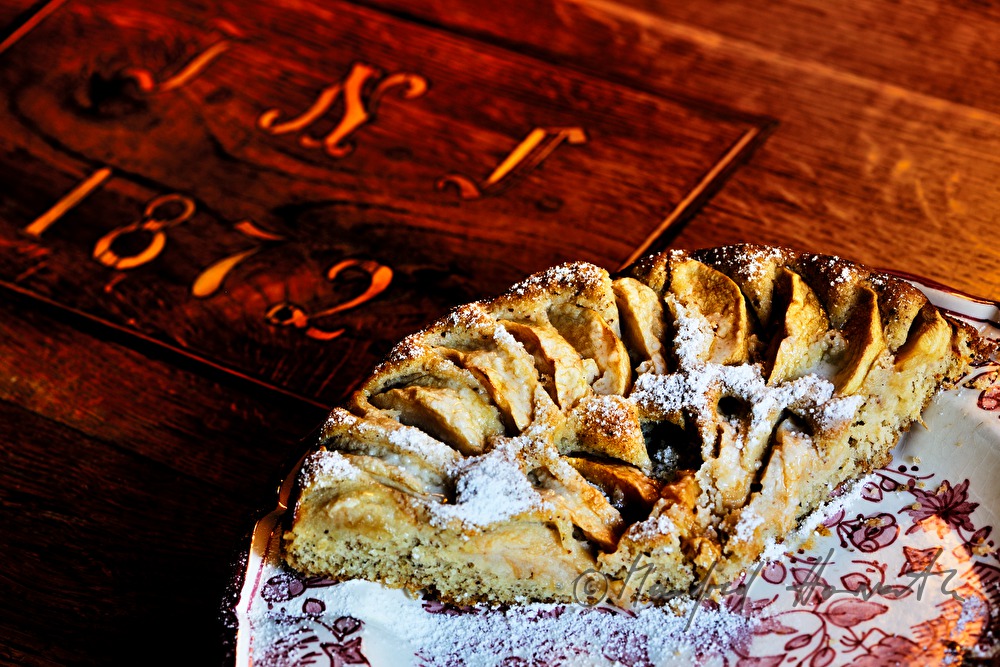 homemade apple pie on an old kitchen table