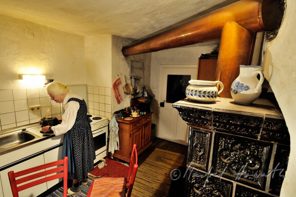 Mrs. Fuchs in the kitchen of her farm house