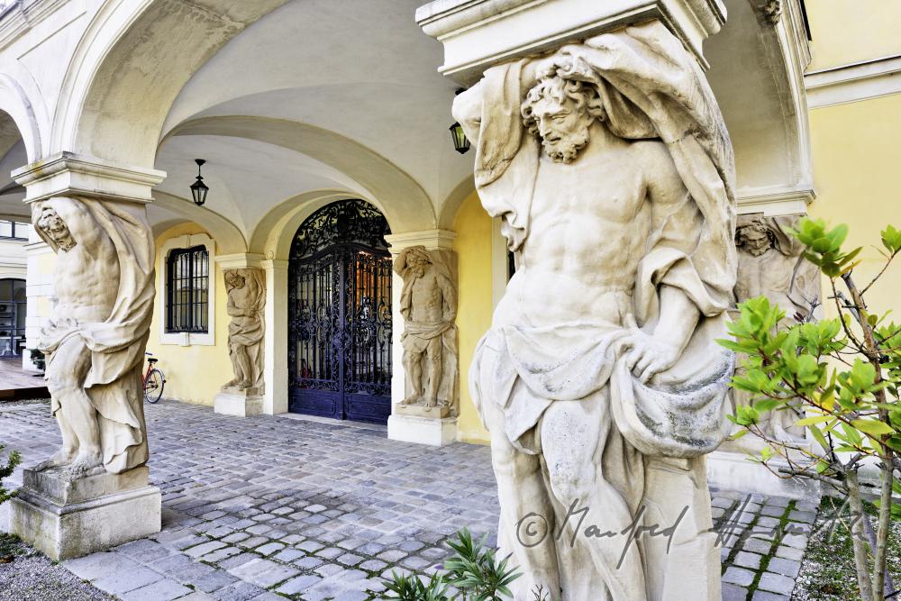 atlasses on the entrance to the castle