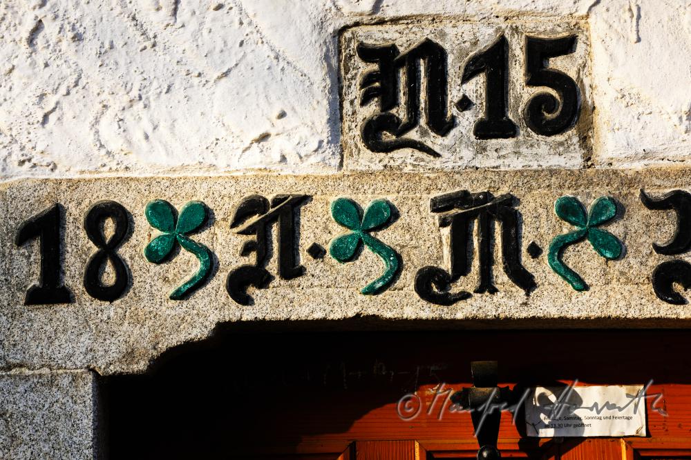 inscription made of iron on the lintel of the farmhouse