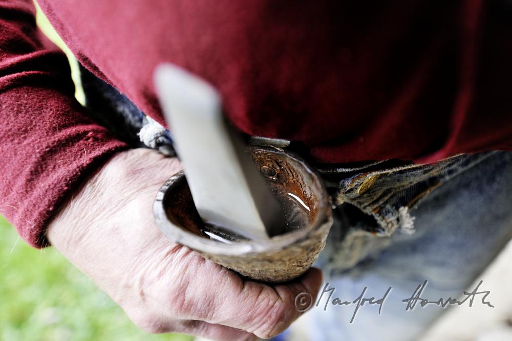 farmer with grindstone for sharpening the skythe