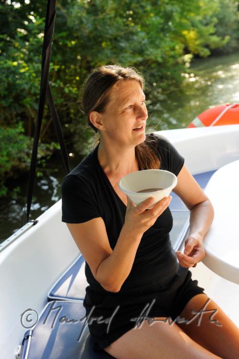 staff drinking morning tea on the sun