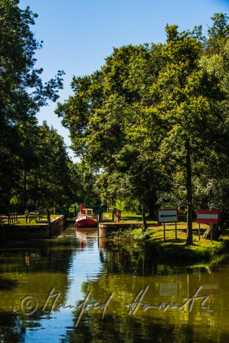 house boat in the lock of Branges on the River Seille
