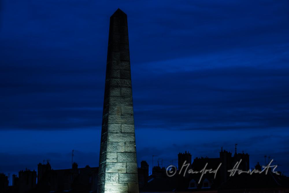 pillar of the bridge over the river Saone and roofscape