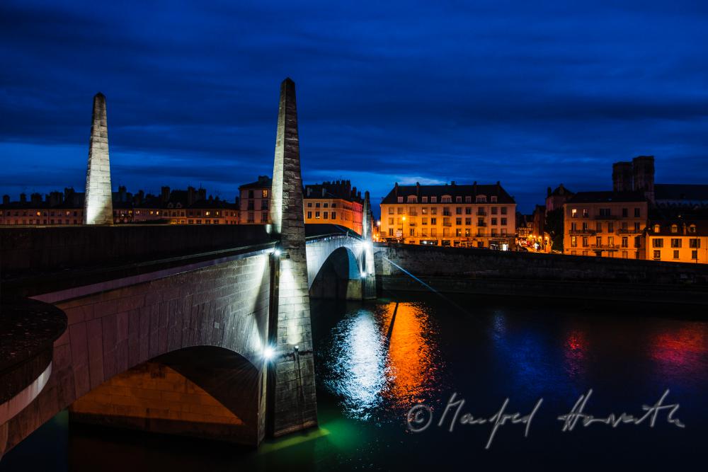 cathedral St. Vincent and column of the bridge over the river Saone