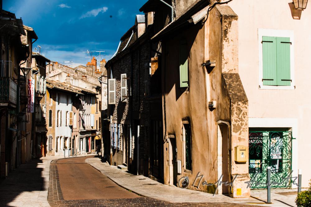 typical street in the town on the river Saone