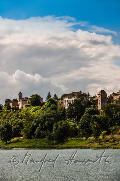 castle on the hill overlooking the river Saone