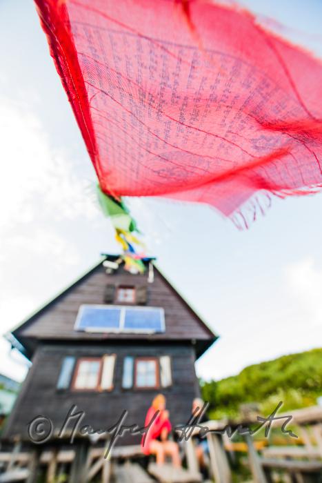 Tibetan prayer flags of the alpine hut 