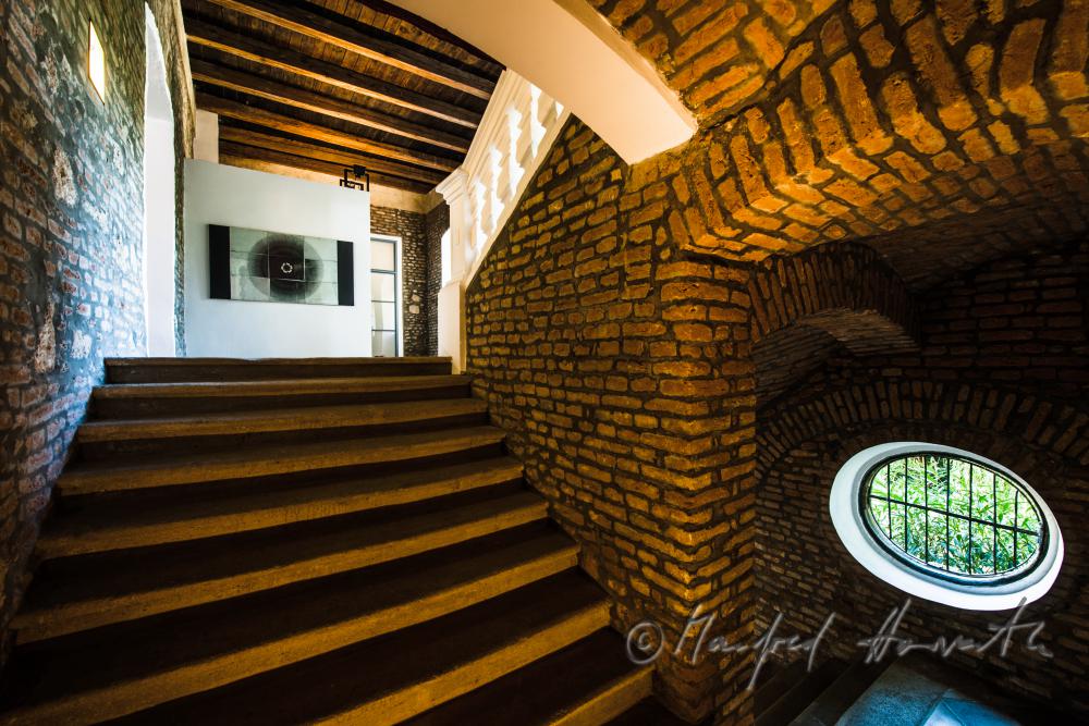 staircase with egg-shaped window