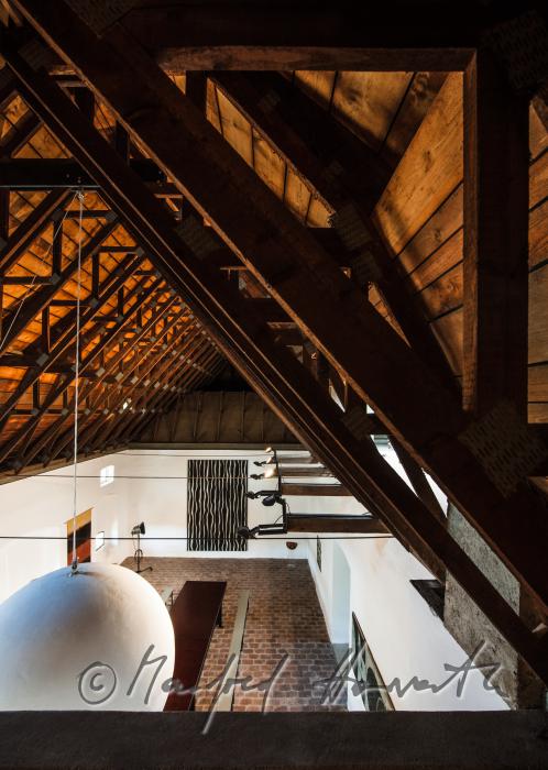 living room with frame-work roof and brick floor