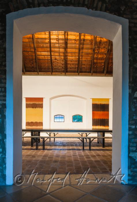 living room with frame-work roof and brick floor
