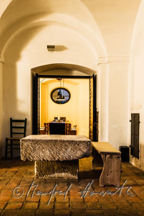 stone table and view into the dining room