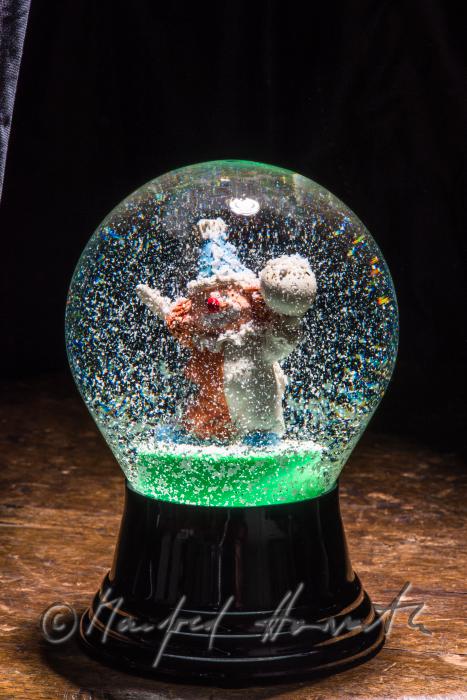 miniature clown in a scow globe