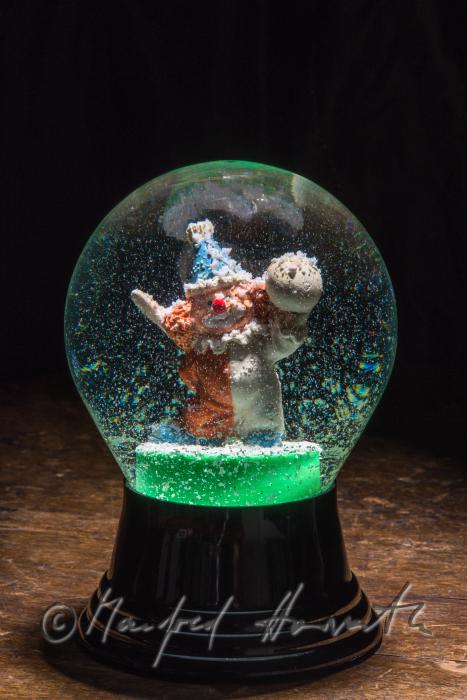 miniature clown in a scow globe