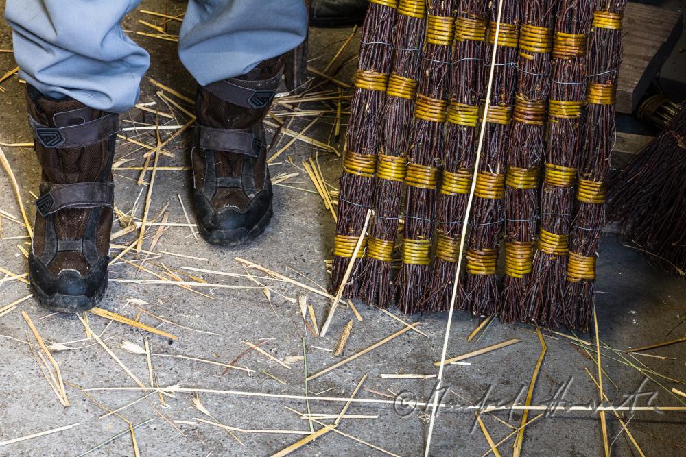 basket braider with footmat made of birch brushwood