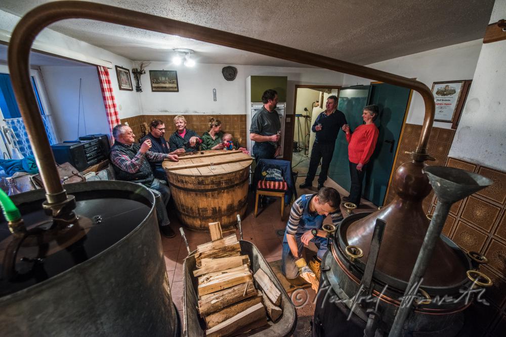 making of Schnaps in the cellar of a farmhouse