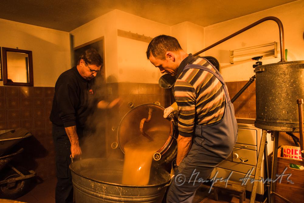 making of Schnaps in the cellar of a farmhouse