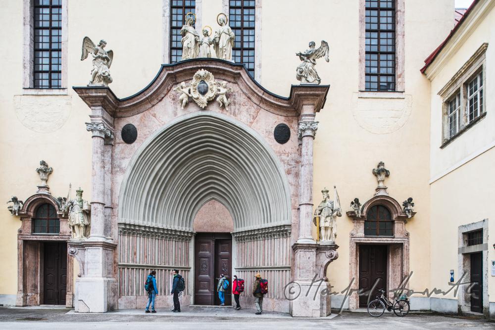 pilgrims on the main gate of the collegiate church