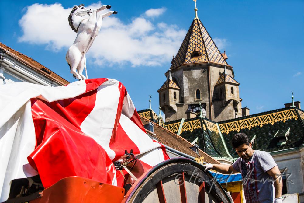 building up a merry-go-around on the main square