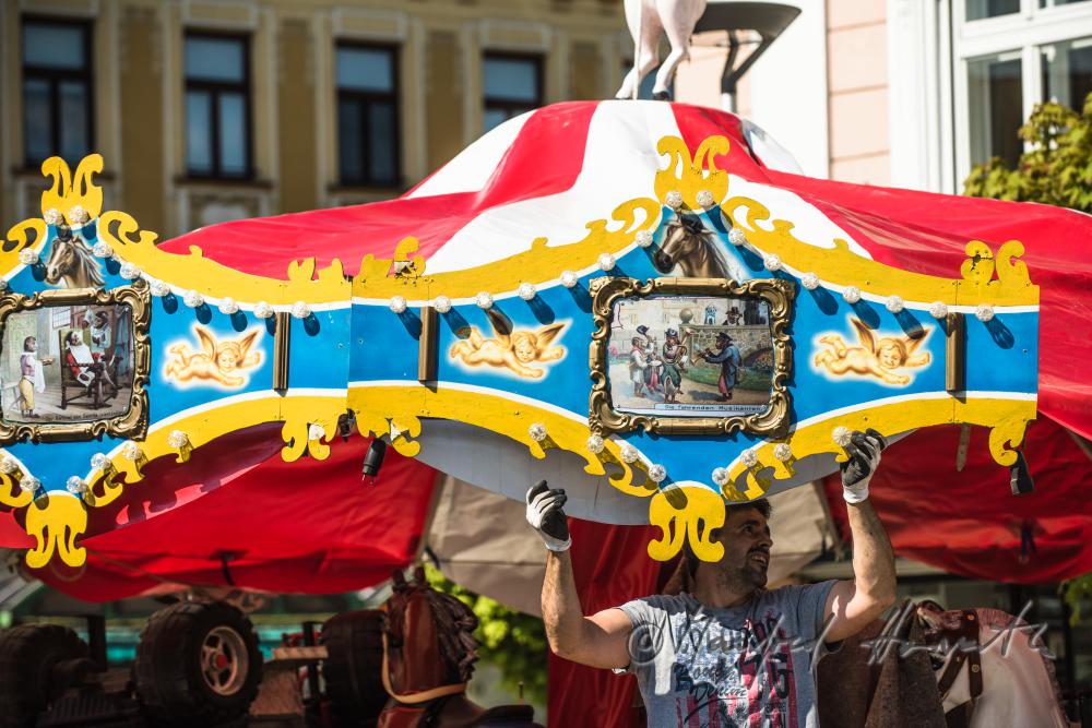 building up a merry-go-around on the main square