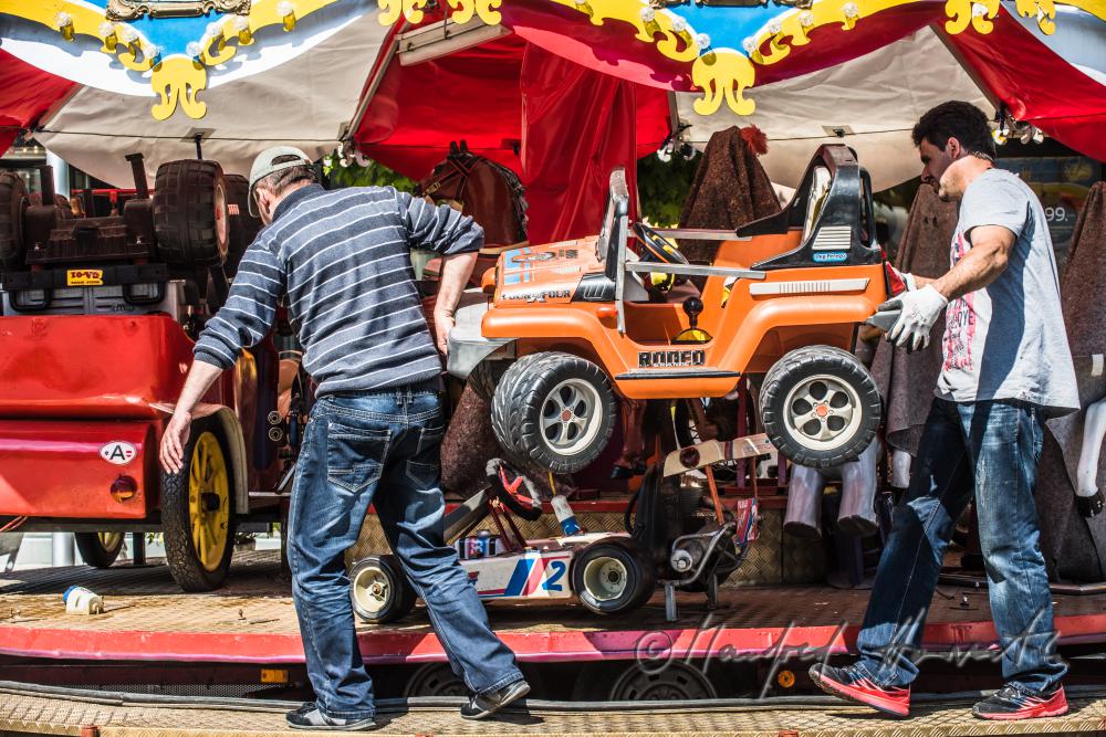 building up a merry-go-around on the main square