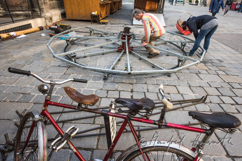 building up a merry-go-around made of recycling parts