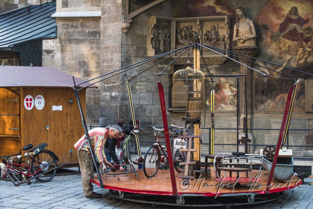 building up a merry-go-around made of recycling parts