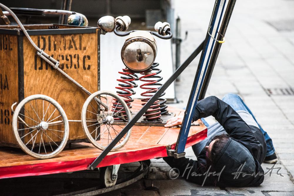 building up a merry-go-around made of recycling parts