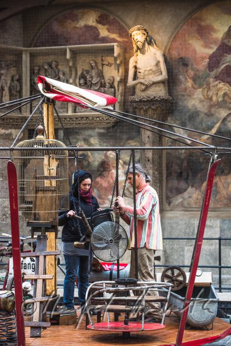 building up a merry-go-around made of recycling parts