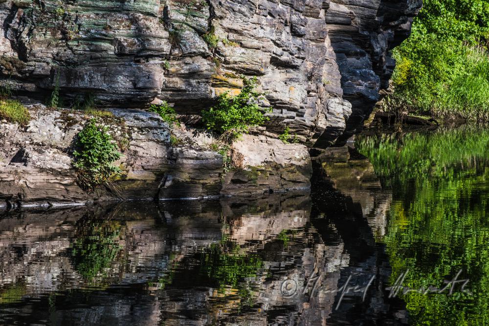 rocky, steep rivershore near the mountain 