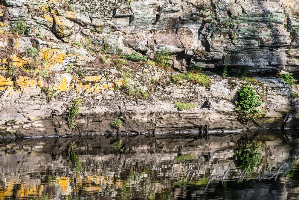 rocky, steep rivershore near the mountain 