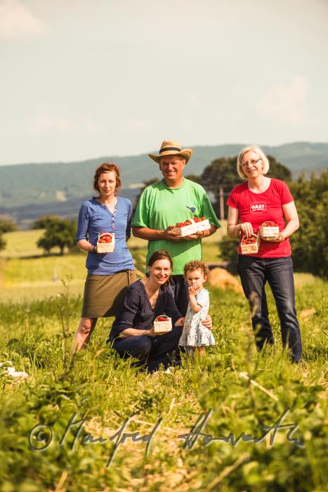 Preisegger family at the strawberry harvest of organic grown strawberries
