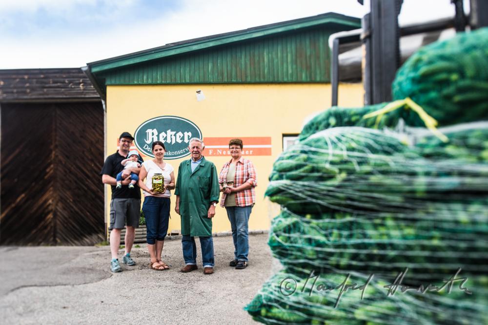 the operators of the preserving plant and a sack of cucumbers
