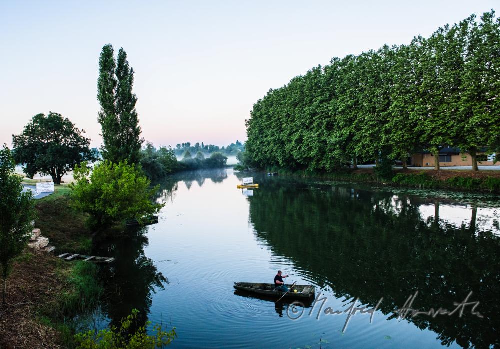 fisherman in the harbour of the river La Seille