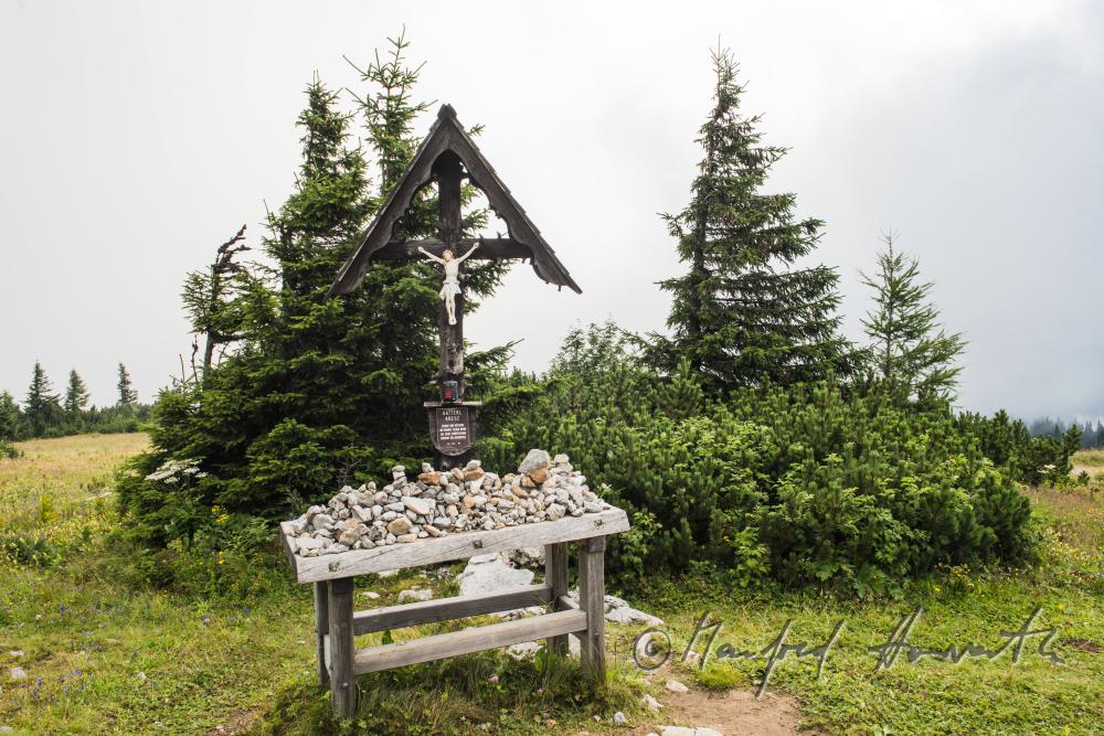 catholic wayside cross with heaped stones