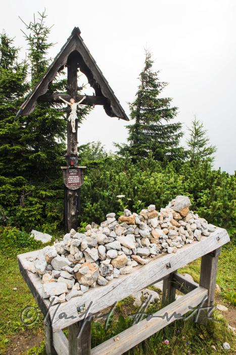 catholic wayside cross with heaped stones