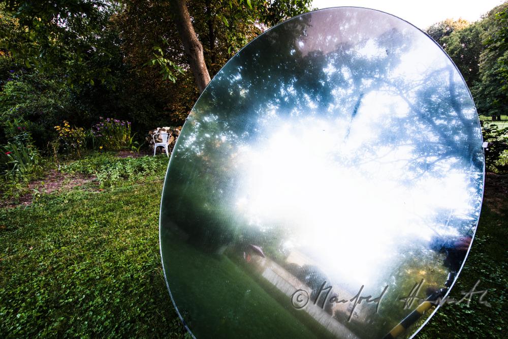 the castle reflects in the mirror (art piece) in the garden